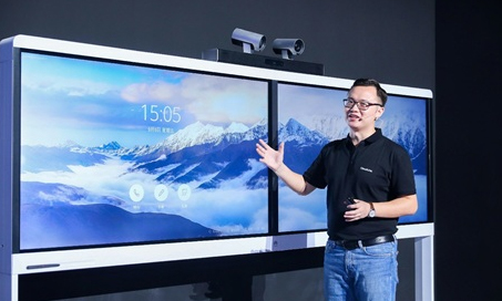 A man is demonstrating Huawei’s video conferencing products