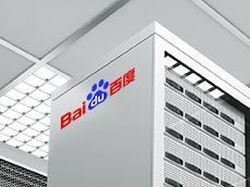Looking upwards to the side of an IT equipment cabinet branded with the Baidu logo, with the room's roof as the background