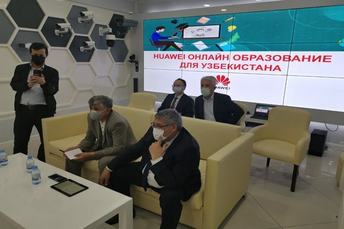A group of executives at Uzbekistan's Tashkent Airport using a Huawei Cloud platform