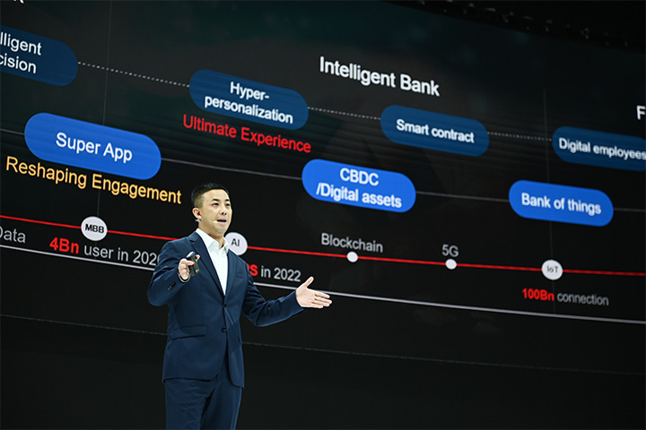 Jason Cao, CEO of Huawei Global Digital Finance is giving a speech at Huawei Intelligent Finance Summit 2022, and the screen behind him shows a diagram illustrating the intelligent bank